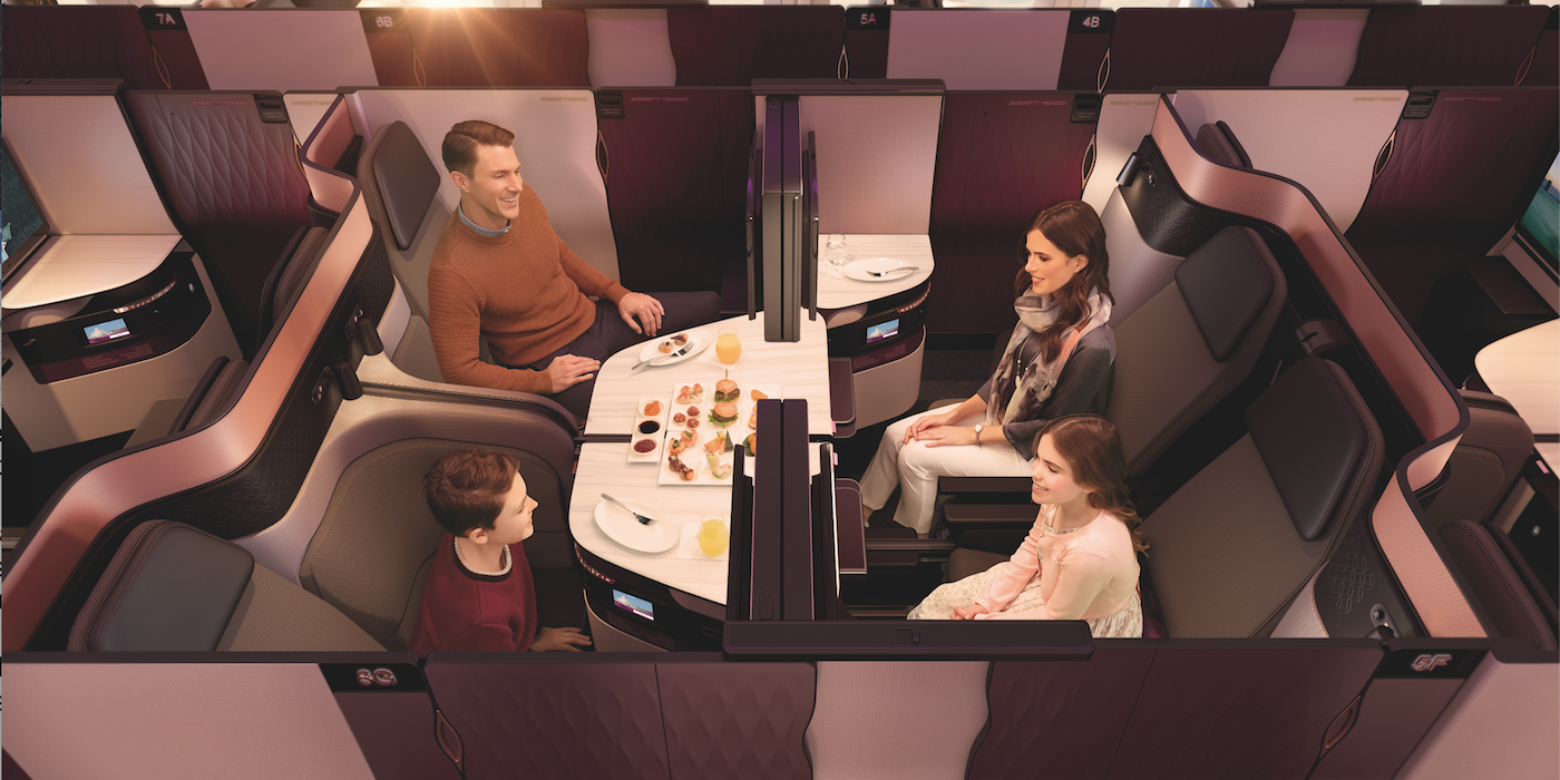 The unique Qsuite business class. Four seats are arranged together, which can be kept separate, or with the simple slide of panels, two, three or all four of the suites can be converted into an open area for a family or other traveling group to dine together. Double beds can also be deployed