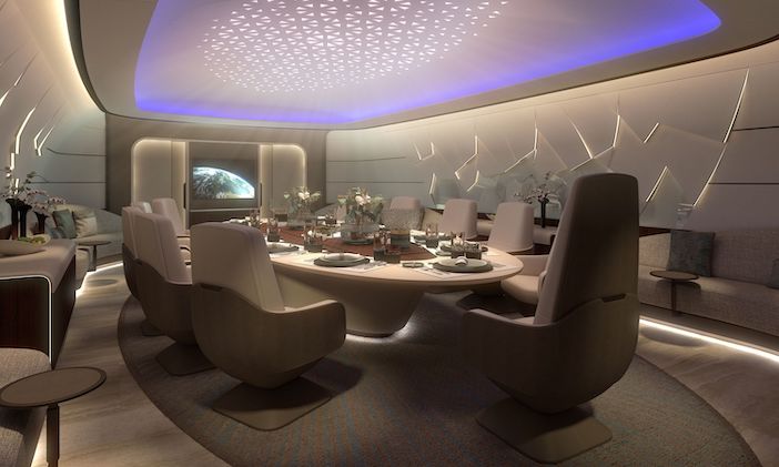 A cabin in Lufthansa Technik's BBJ 777-9 concept, with a large table that can be used for conferences or dining